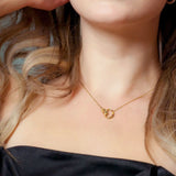 lady wearing a Adamar Jewels VISTOSO Cherish Necklace in 18K yellow gold set with colour sapphire and diamonds