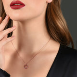 Lady wearing a Adamar Jewels VISTOSO Lucky Wheel Necklace in 18K rose gold with colour sapphire and diamonds