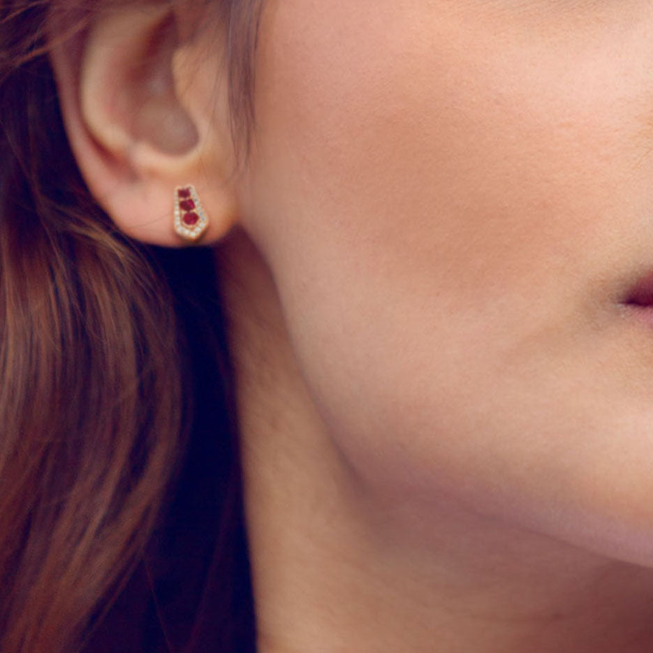 Lady wearing a Adamar Jewels CREENCIA Dulce Earrings in 18K rose gold set with ruby and diamonds