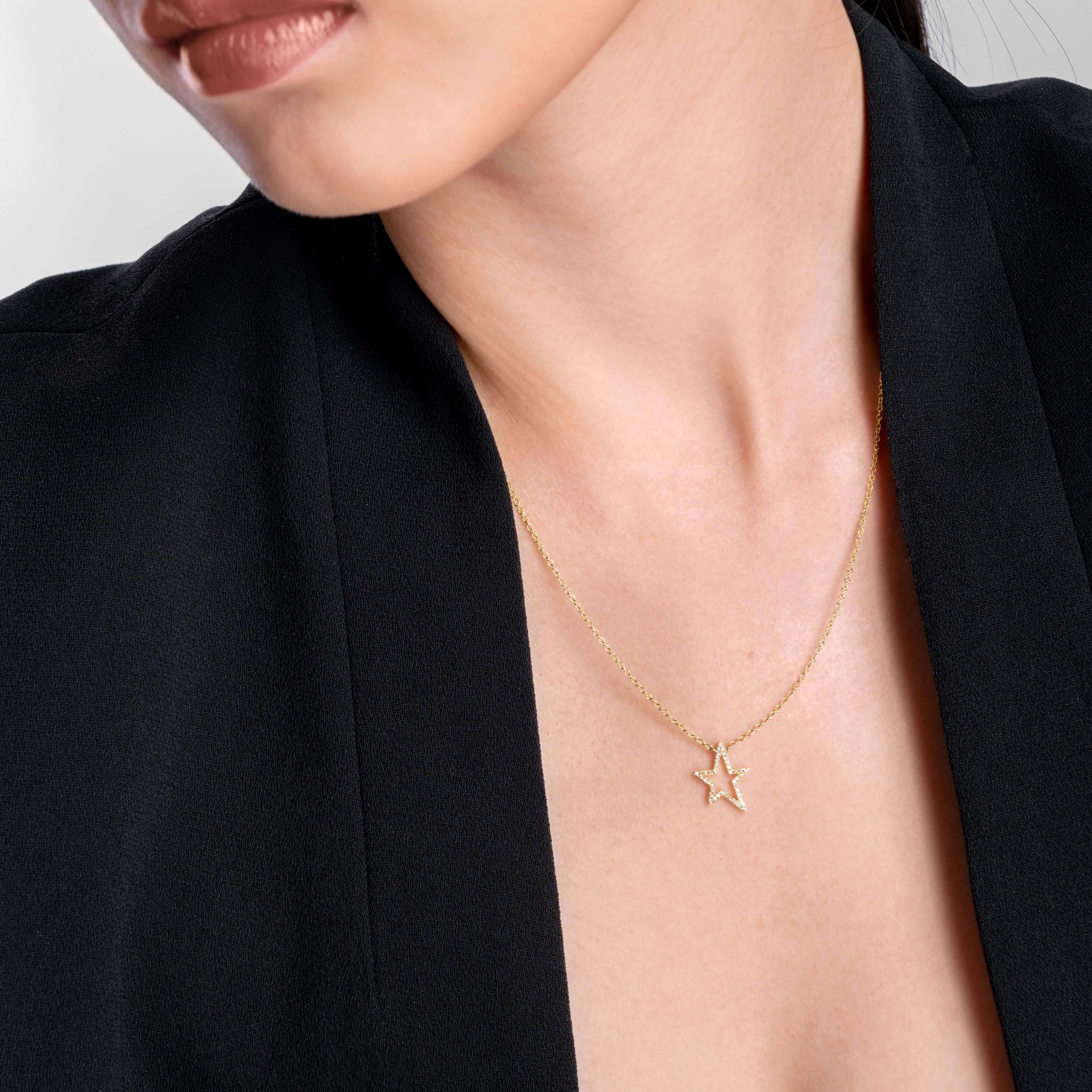 Lady wearing a Adamar Jewels LUZ Mito Necklace in 18K yellow gold set with diamonds